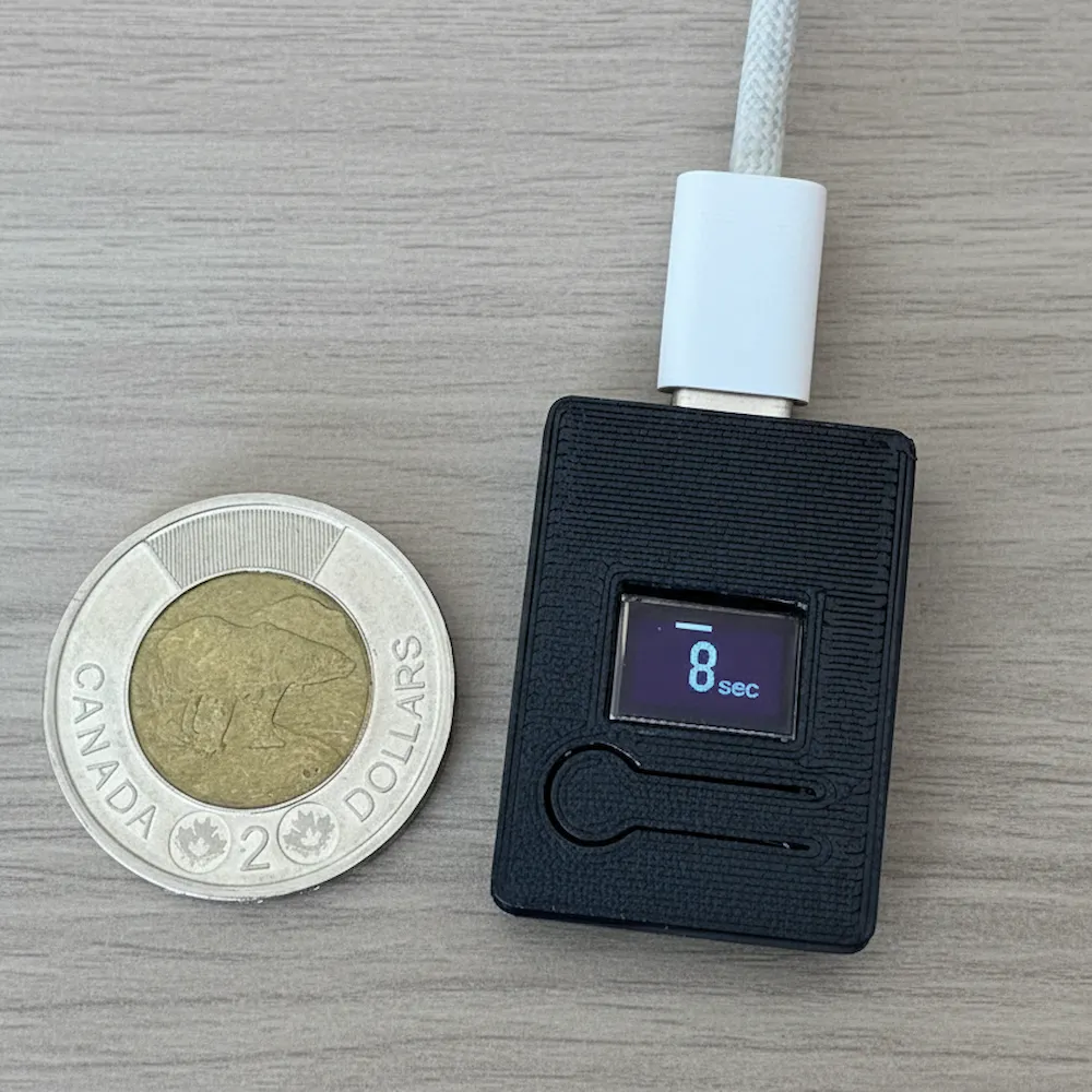 ShutterLapse next to a coin for scale